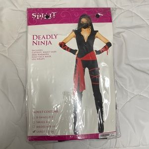 Size large 12-14 deadly ninja costume. Never worn!! Brand new with tags!!!!!!
